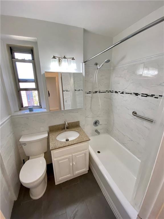 90 Bryant Ave Unit 5B-E, White Plains, NY 10605 - full bath with toilet, vanity, washtub / shower combination, tile patterned floors, and tile walls