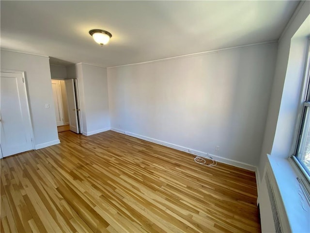 90 Bryant Ave Unit 5B-E, White Plains, NY 10605 - unfurnished bedroom featuring light wood-style floors, crown molding, and baseboards