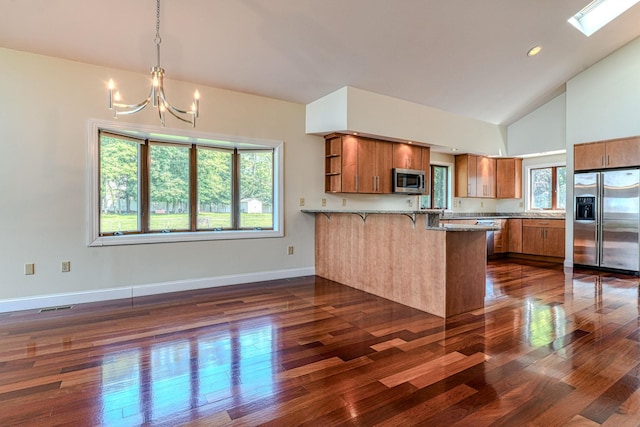 6 Riverside, Cornwall On Hudson, NY 12520 - kitchen featuring stainless steel appliances, brown cabinets, dark wood-style flooring, and high vaulted ceiling