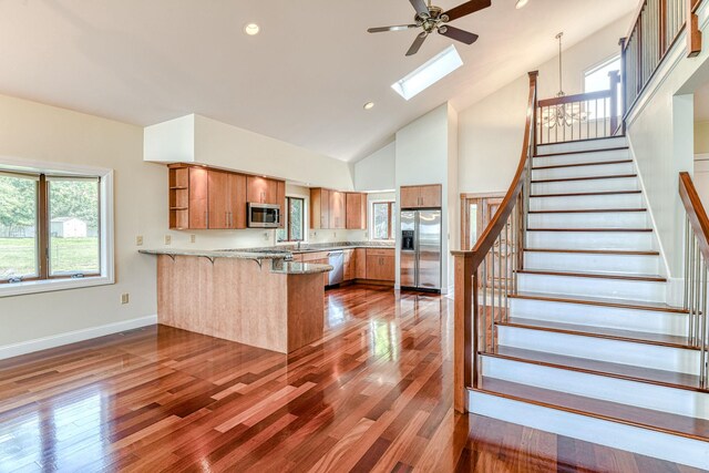 6 Riverside, Cornwall On Hudson, NY 12520 - kitchen featuring stainless steel appliances, a peninsula, brown cabinetry, open shelves, and a ceiling fan