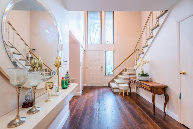 43 Carriage Ct, Jericho, NY 11753 - entrance foyer with stairway, dark wood-type flooring, and baseboards