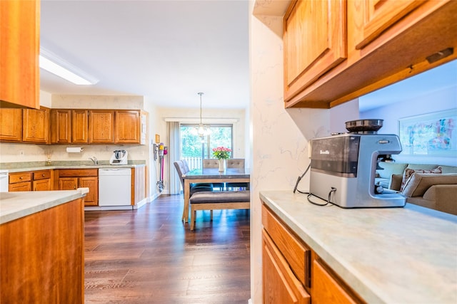 43 Carriage Ct, Jericho, NY 11753 - kitchen with dishwasher, light countertops, dark wood finished floors, brown cabinets, and decorative light fixtures