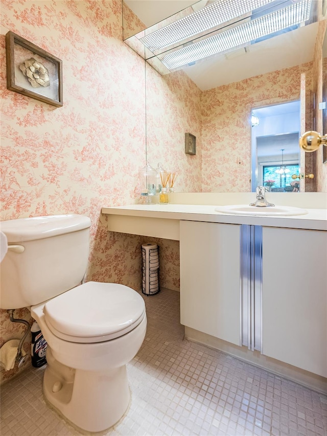 43 Carriage Ct, Jericho, NY 11753 - bathroom with wallpapered walls, toilet, tile patterned floors, and vanity