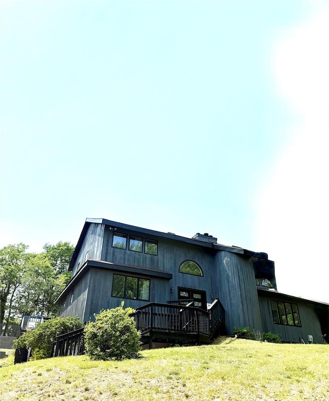 50 Noahs Path, Rocky Point, NY 11778 - rear view of property featuring a deck and a lawn