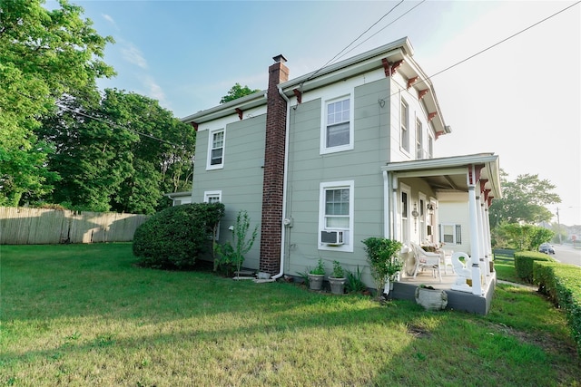 56 Academy St, Patchogue, NY 11772 - rear view of property with a chimney
