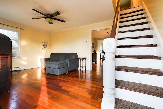 56 Academy St, Patchogue, NY 11772 - stairs featuring wood finished floors, a ceiling fan, baseboard heating, and crown molding
