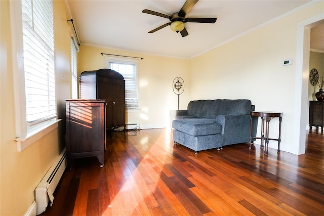 56 Academy St, Patchogue, NY 11772 - sitting room with a ceiling fan, wood finished floors, ornamental molding, and baseboard heating