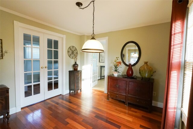 56 Academy St, Patchogue, NY 11772 - dining room with french doors, wood finished floors, and ornamental molding