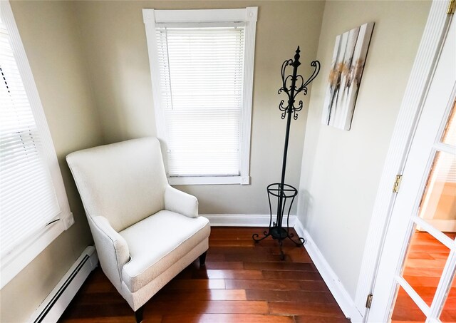 56 Academy St, Patchogue, NY 11772 - living area featuring a baseboard radiator and hardwood / wood-style flooring