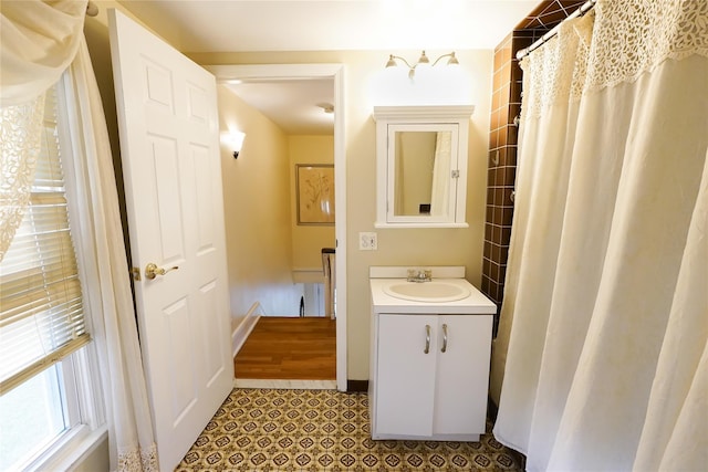56 Academy St, Patchogue, NY 11772 - bathroom featuring vanity and baseboards