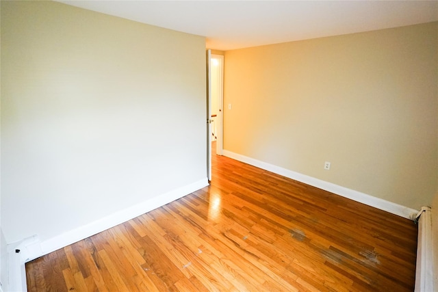 56 Academy St, Patchogue, NY 11772 - empty room with light wood-style flooring and baseboards
