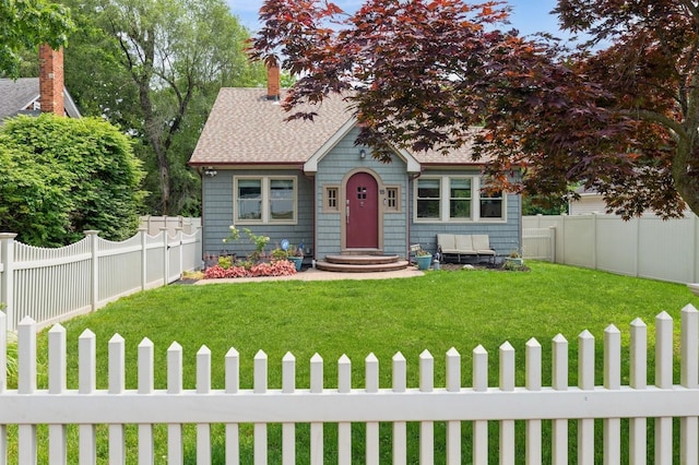 15 Orchard Rd, East Patchogue, NY 11772 - view of front of property featuring a fenced backyard and roof with shingles