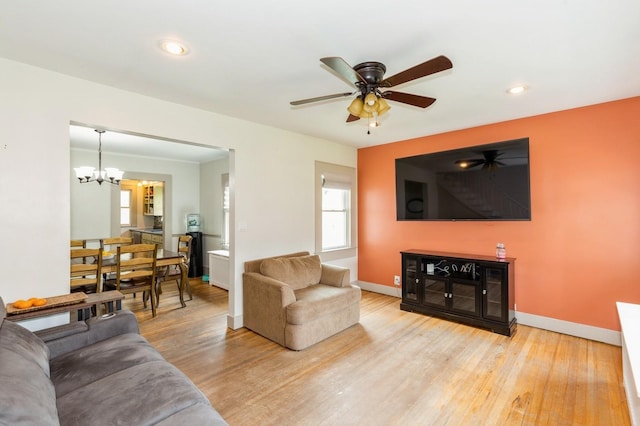 15 Orchard Rd, East Patchogue, NY 11772 - living room featuring light wood-style floors, plenty of natural light, a chandelier, and recessed lighting
