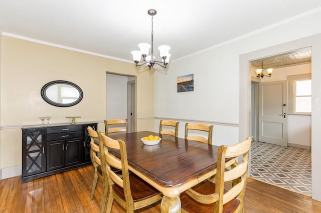 15 Orchard Rd, East Patchogue, NY 11772 - dining room featuring a chandelier, crown molding, and dark wood finished floors