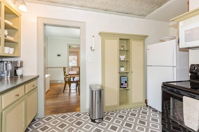 15 Orchard Rd, East Patchogue, NY 11772 - kitchen featuring white appliances, cream cabinets, dark countertops, light flooring, and ornamental molding