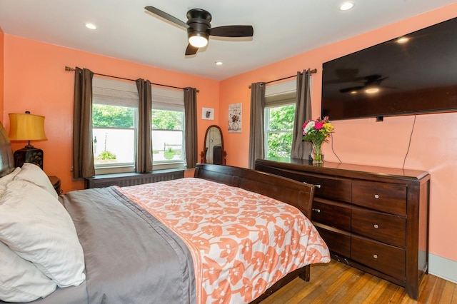 15 Orchard Rd, East Patchogue, NY 11772 - bedroom with hardwood / wood-style flooring, multiple windows, radiator, recessed lighting, and a ceiling fan