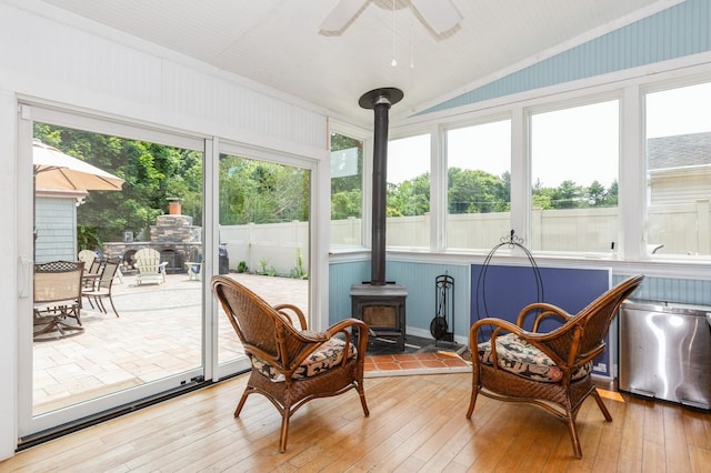15 Orchard Rd, East Patchogue, NY 11772 - sunroom / solarium featuring a wood stove and lofted ceiling