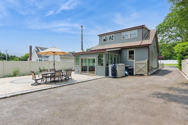15 Orchard Rd, East Patchogue, NY 11772 - back of house with a patio, roof with shingles, and a fenced backyard