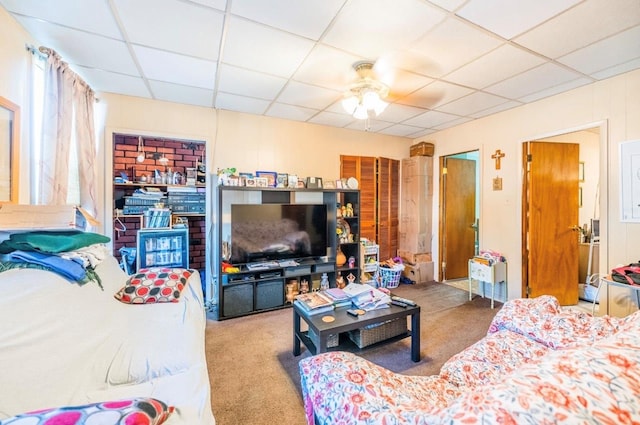5883 57th Rd, Maspeth, NY 11378 - carpeted living room featuring a drop ceiling and ceiling fan
