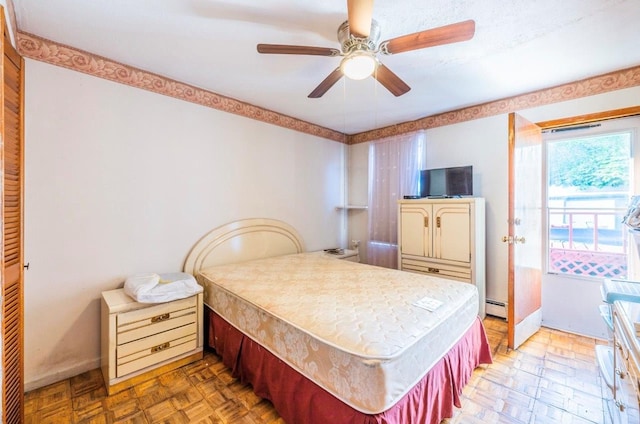 5883 57th Rd, Maspeth, NY 11378 - bedroom featuring baseboard heating and a ceiling fan