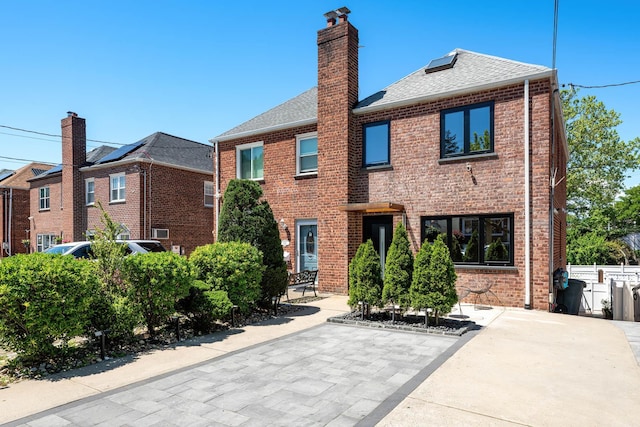 1363 Kearney Ave, Bronx, NY 10465 - back of house featuring brick siding, roof with shingles, and a chimney