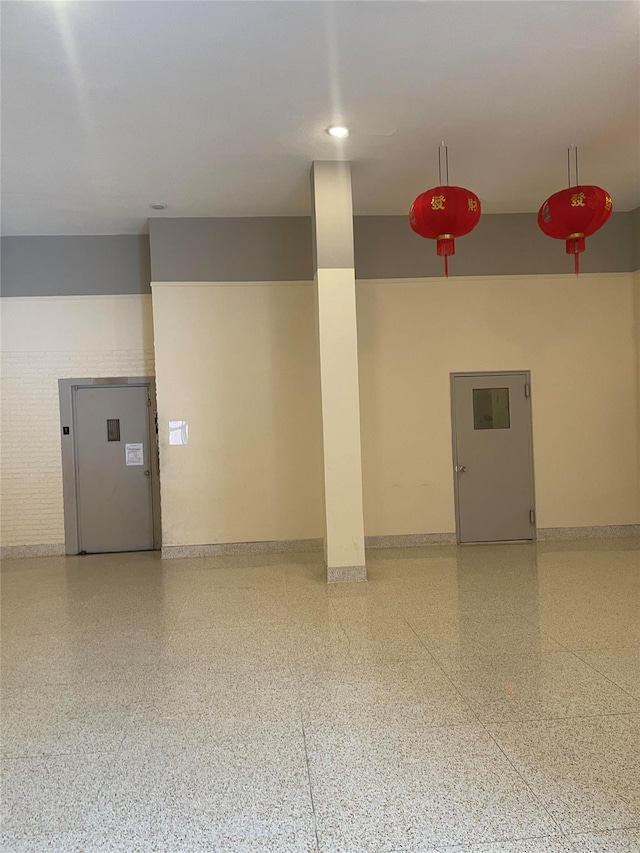 134-54 Maple Ave Unit 2S, Flushing, NY 11355 - empty room with speckle patterned floor and baseboards