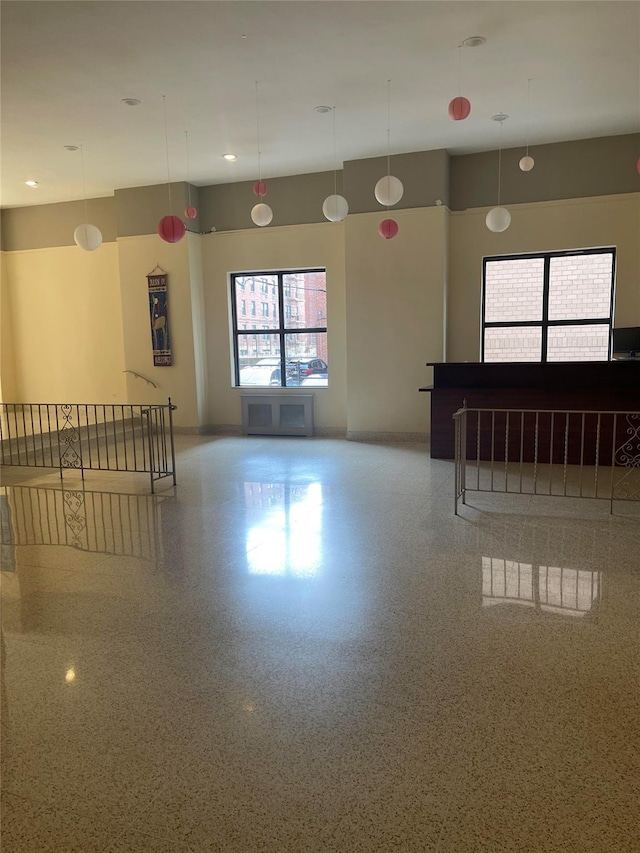 134-54 Maple Ave Unit 2S, Flushing, NY 11355 - spare room featuring speckle patterned floor and baseboards