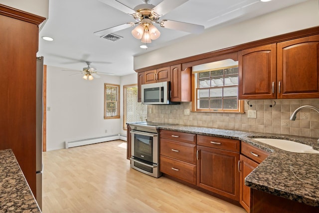 206 Lower Sheep Pasture Rd, Setauket, NY 11733 - kitchen with a baseboard radiator, appliances with stainless steel finishes, a ceiling fan, tasteful backsplash, and recessed lighting