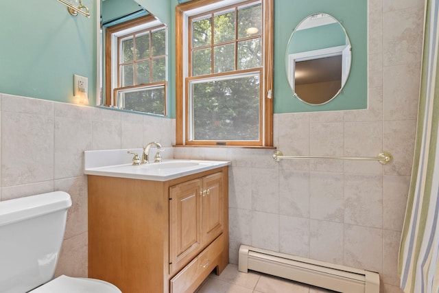 206 Lower Sheep Pasture Rd, Setauket, NY 11733 - bathroom with tile walls, a baseboard heating unit, vanity, and tile patterned floors