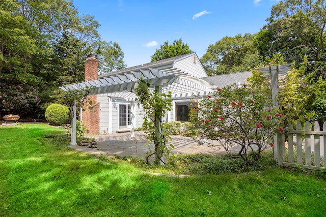 206 Lower Sheep Pasture Rd, Setauket, NY 11733 - back of property with a pergola, a chimney, and a patio