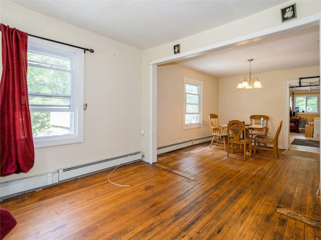 413 Vassar Rd, Poughkeepsie, NY 12603 - dining room featuring hardwood / wood-style flooring, plenty of natural light, and a baseboard radiator