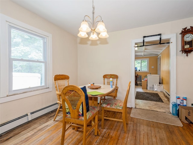 413 Vassar Rd, Poughkeepsie, NY 12603 - dining room featuring a baseboard heating unit, light wood-style floors, baseboard heating, and a chandelier