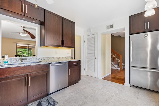 59 Krystal Dr, Somers, NY 10589 - kitchen featuring stainless steel appliances, a ceiling fan, dark brown cabinetry, and light tile patterned floors
