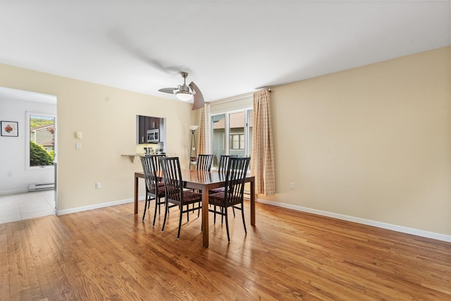 59 Krystal Dr, Somers, NY 10589 - dining space with a baseboard heating unit, light wood-style flooring, and a ceiling fan