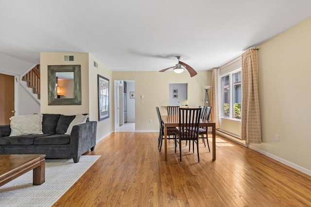 59 Krystal Dr, Somers, NY 10589 - dining space featuring light wood-style flooring, ceiling fan, and stairway