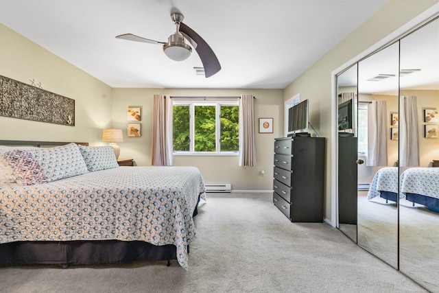 59 Krystal Dr, Somers, NY 10589 - carpeted bedroom with a closet, a baseboard heating unit, and a ceiling fan