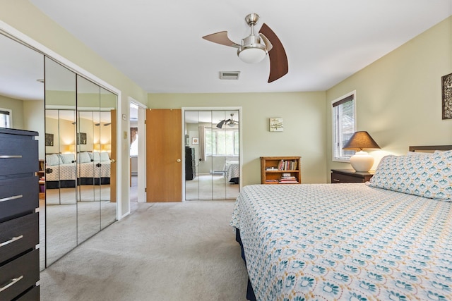 59 Krystal Dr, Somers, NY 10589 - bedroom featuring multiple windows, carpet flooring, two closets, and ceiling fan