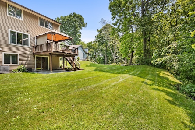 59 Krystal Dr, Somers, NY 10589 - view of grassy yard featuring a wooden deck, stairway, and a patio area