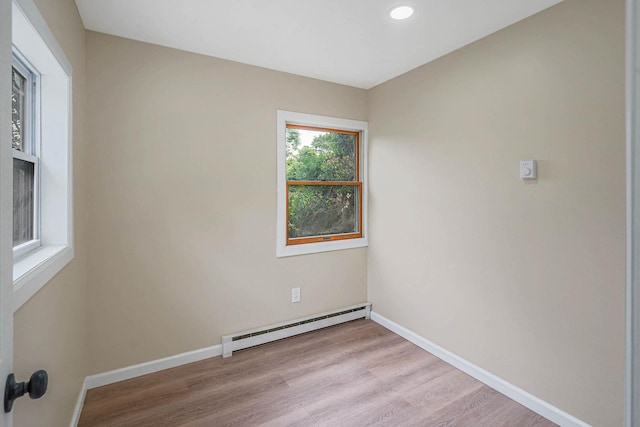 18 Port Jefferson Rd, Sound Beach, NY 11789 - empty room with a baseboard radiator, light wood finished floors, baseboards, and recessed lighting