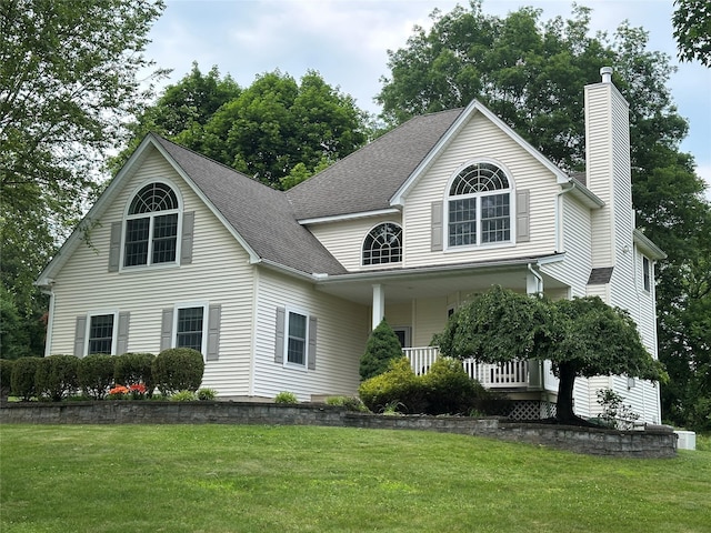 30 Commonwealth Ave, Balmville, NY 12550 - view of front of home with a chimney, a front lawn, a porch, and roof with shingles