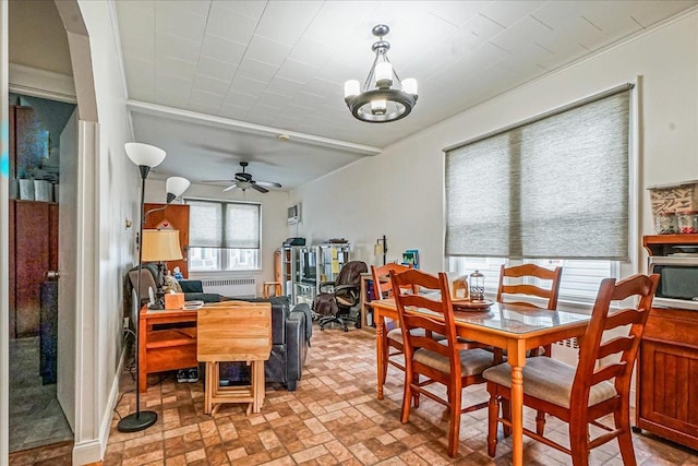 10712 Sutter Ave, Ozone Park, NY 11417 - dining room with radiator heating unit, a ceiling fan, brick patterned flooring, and ornamental molding