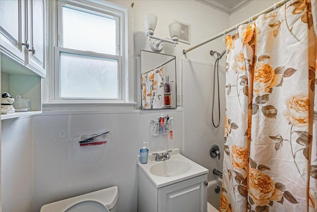 10712 Sutter Ave, Ozone Park, NY 11417 - bathroom with toilet, plenty of natural light, vanity, and shower / bathtub combination with curtain