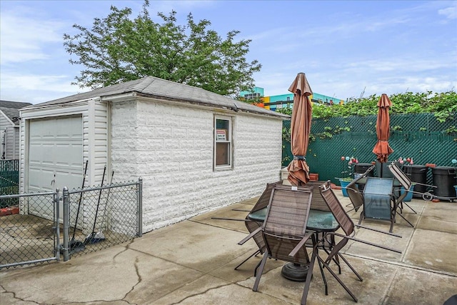 10712 Sutter Ave, Ozone Park, NY 11417 - view of patio / terrace featuring an outdoor structure and outdoor dining area