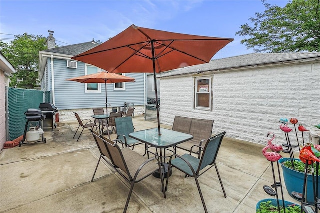 10712 Sutter Ave, Ozone Park, NY 11417 - view of patio / terrace with outdoor dining space and a wall mounted air conditioner