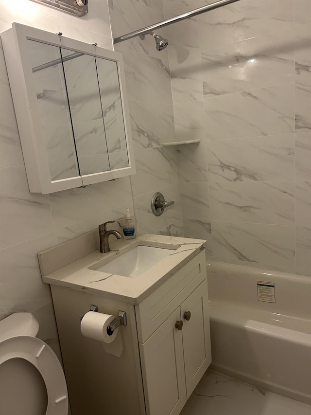 43-25 Douglaston Pkwy Unit 2D, Douglaston, NY 11363 - full bath with vanity, marble finish flooring, washtub / shower combination, and tile walls