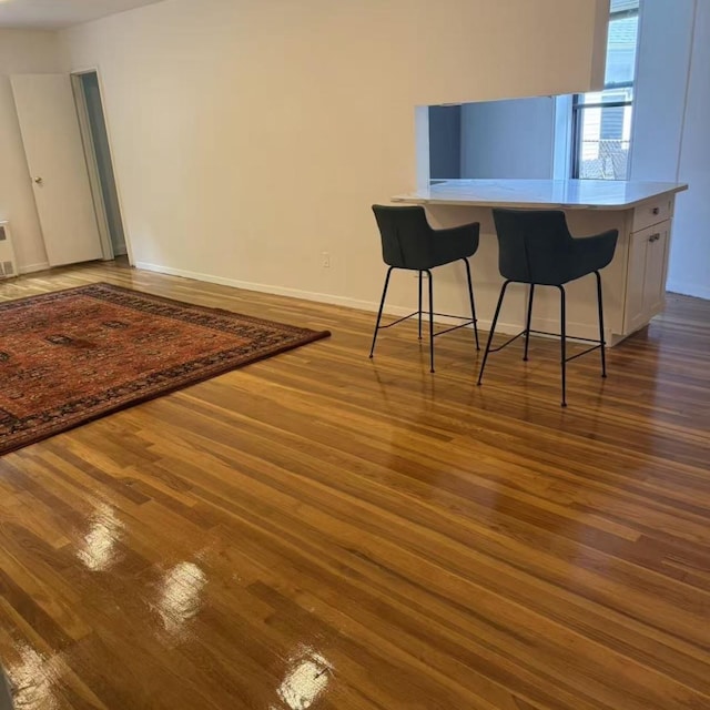 43-25 Douglaston Pkwy Unit 2D, Douglaston, NY 11363 - dining space featuring wood finished floors and baseboards