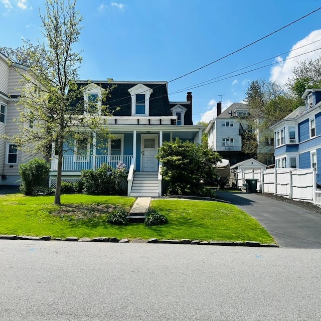 22 Spring St, Port Chester, NY 10573 - victorian home featuring mansard roof, a porch, and a residential view