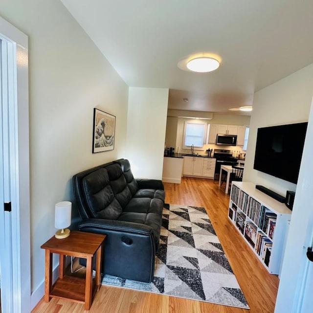 22 Spring St, Port Chester, NY 10573 - living area featuring light wood-style floors