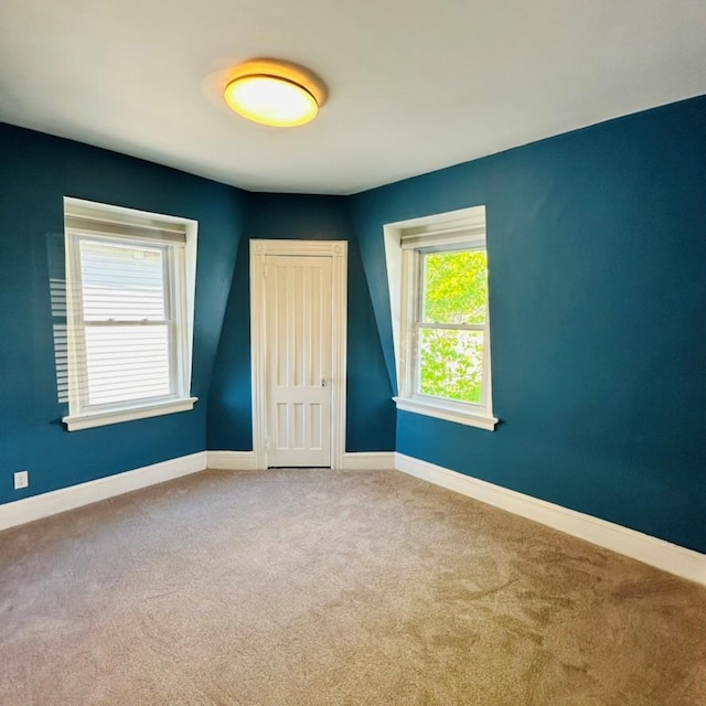 22 Spring St, Port Chester, NY 10573 - unfurnished bedroom with carpet, baseboards, and a closet