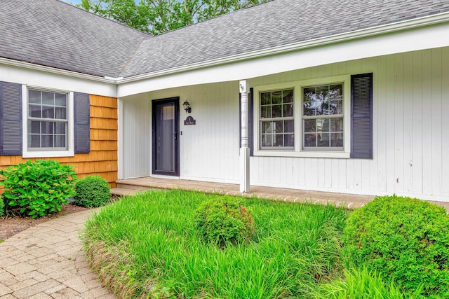2 The Spout, Smithtown, NY 11787 - doorway to property featuring roof with shingles and covered porch